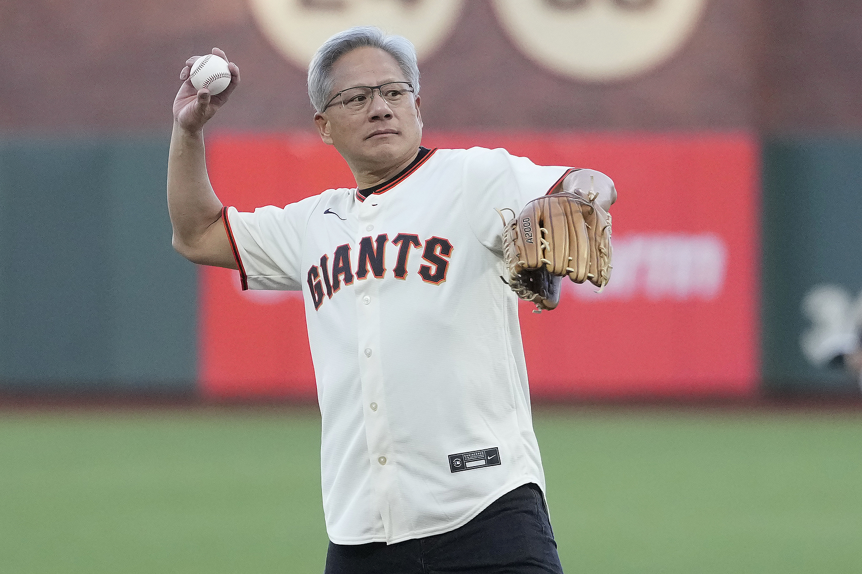 Jensen Huang throws out the ceremonial first pitch before a baseball game, Sep 3, 2024